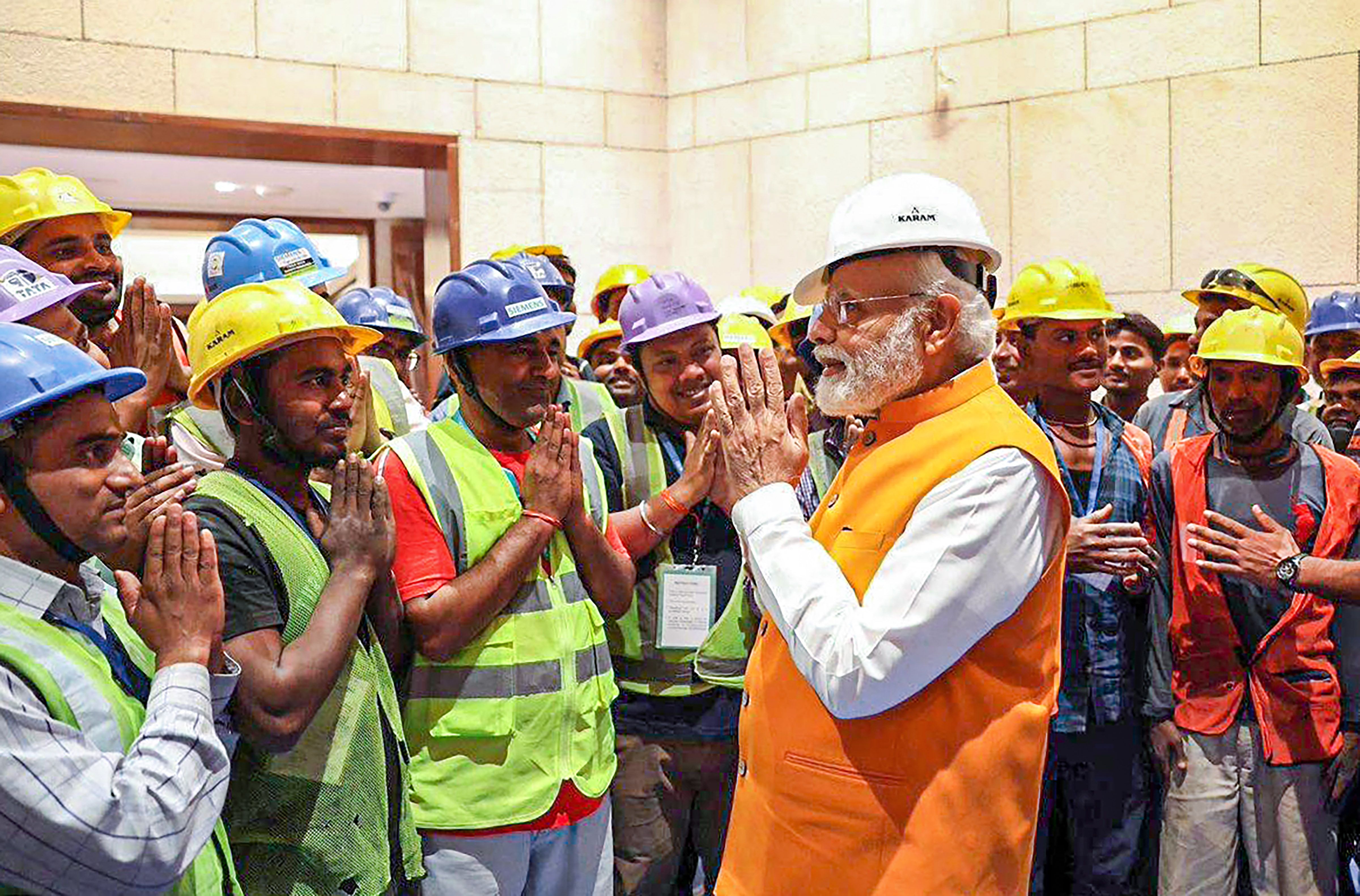 Prime Minister Narendra Modi interacts with ‘Shram Jeevis’ associated with construction of the new Parliament building