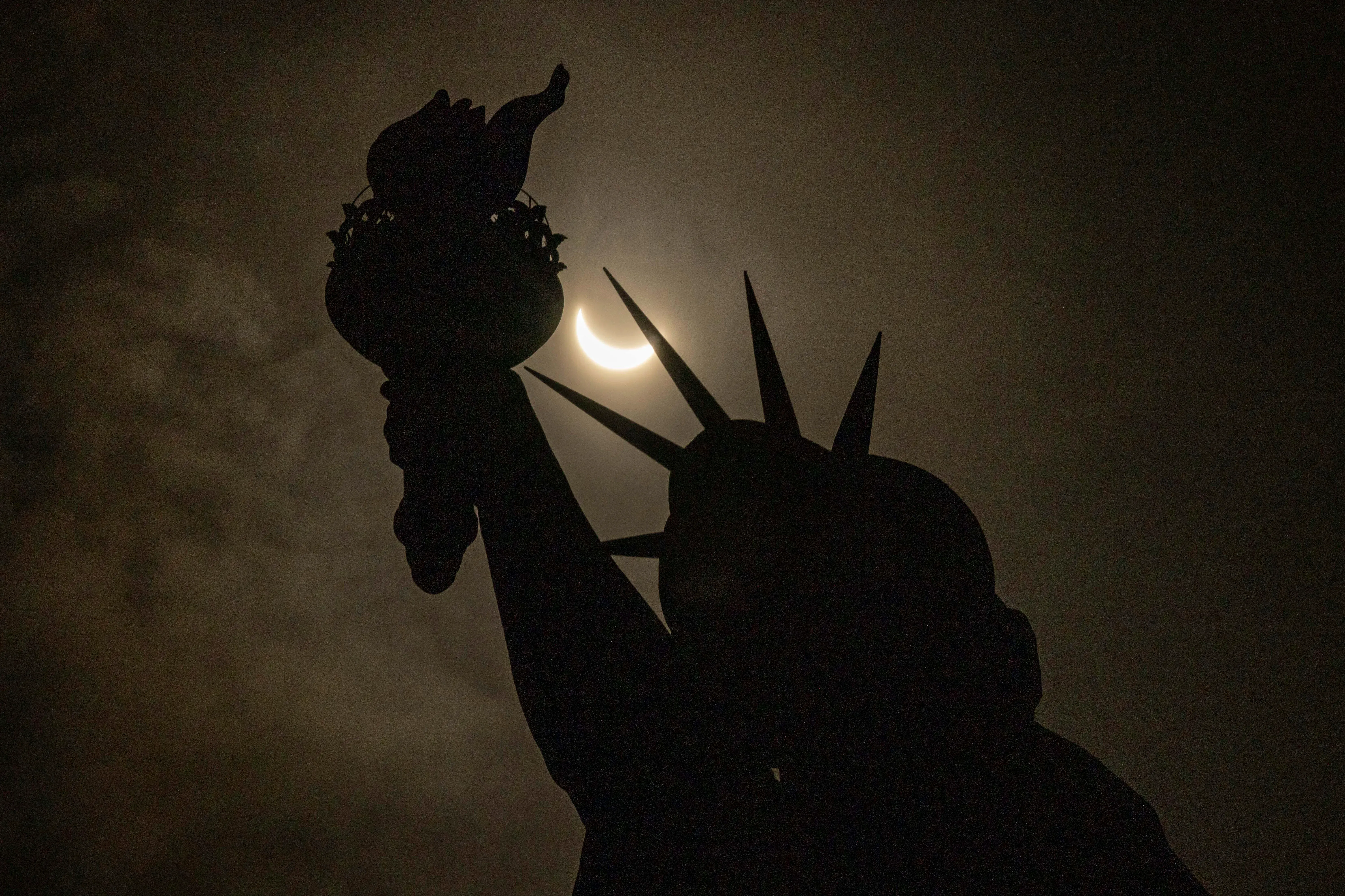 solar eclipse from statue of liberty
