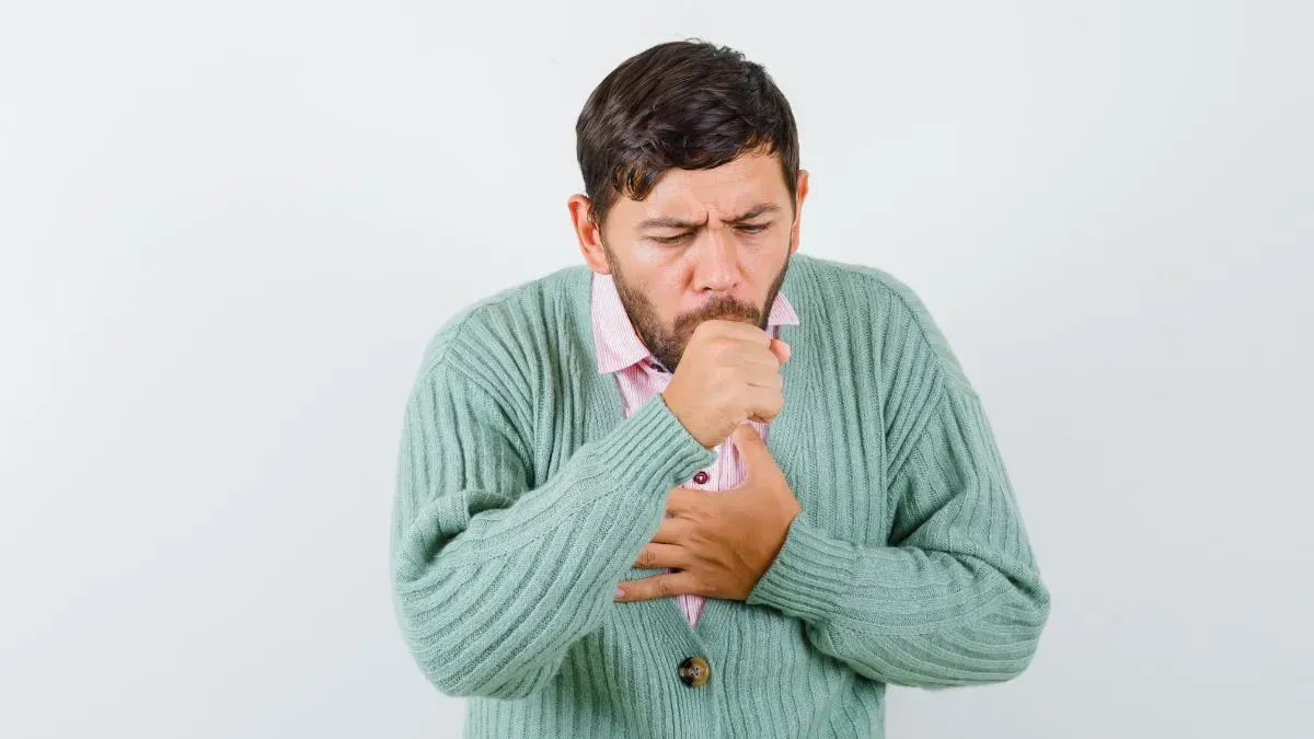 man coughing