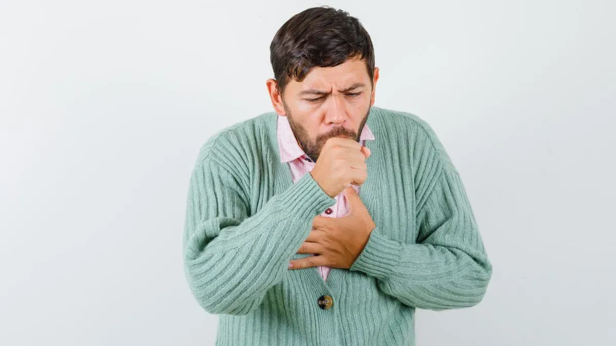 man coughing