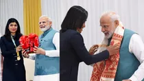 PM Modi gifted boxing gloves and Assamese Gomcha by Nikhat Zareen and Hima Das 