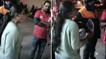 woman beating zomato delivery guy