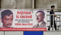 Hoarding comparing Delhi CM Arvind Kejriwal with Hitler
