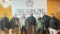 United Nations apologises for photo of its personnel in front of Taliban flag