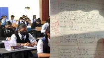 Student write songs lyrics in exam