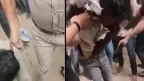 viral video of policeman dragging thief with blooded injured hand