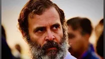 Rahul gandhis tweet of photo of minor rape victims parents