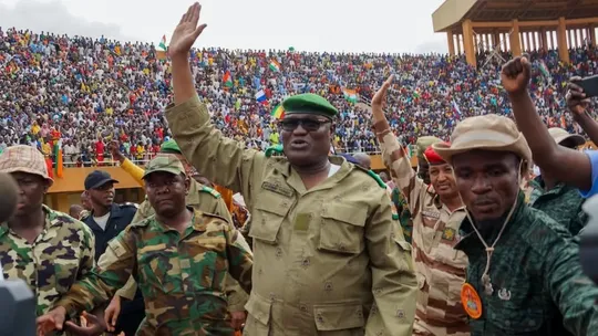 Niger’s coup leaders waving at a crowd of supporters in Niamey on August 6, 2023. Balima Boureima/Anadolu Agency via Getty Images