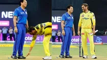 edited image dhoni touching sachin feet