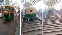 viral video shows auto rikshaw running on foot over bridge to avoid traffic delhi driver arrested