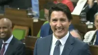Prime minister of Canada Justin Trudeau sticks his tongue and winks at the new speaker Greg Fergus. 