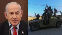 Palestinian fighters ride in an seized Israeli military vehicle. 