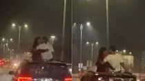 viral video of couple kissing in moving car