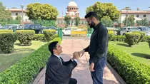 same sex marriage petitoners exchange rings in supreme court premise said fight will continue