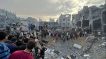 Palestinians search for casualties at the site of Israeli strikes on houses in Jabalia refugee camp in the northern Gaza Strip
