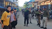 Curfew imposed in Imphal after a mob tries to loot arms from first Manipur Rifle campus. 