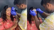 Viral Video of women tattoo on forehead