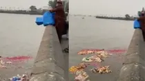 mumbai police registered FIR against a man throwing garbage in sea near gateway of india