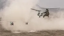 A handout picture provided by the Iranian Army media office on October 28, 2023 shows helicopters during a military drill in the Isfahan province in central Iran. (AFP/File)