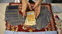 Larra Shah, an Indian mystic, shows cards during an interview with AFP