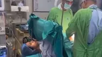 woman singing bhajan during C-section delivery