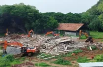 Bulldozer action on YSRCP office (photo-PTI)