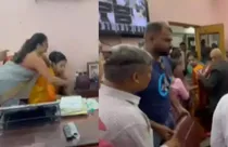 School principal forcibly removed from chair (screengrab)