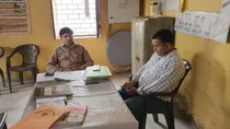 sambhal govt school teacher suspended used phone for over two hours during duty hours dm inspection