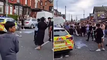uk leeds violence bus on fire police car overturned video viral children care agency riots 