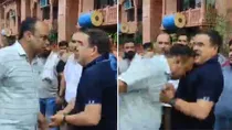 varanasi adm alok verma attacks hotel owner with head video viral demolition up 