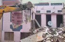 bulldozer action on accused student house (screengrab-ANI)