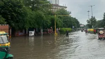 delhi heavy rain waterlogging traffic jam weather update viral photos videos imd yellow alert