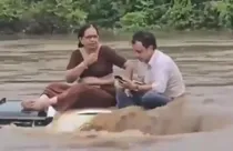 Gujarat couple sat on car roof to save life (screengrab-india today)