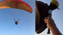 paragliding man gives lighter to tourists in goa viral video