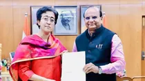 Atishi with LG VK Saxena