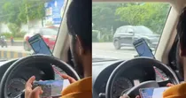 Driver Playing mobile game while Driving