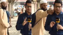 Man Adjusts Journalist Collar