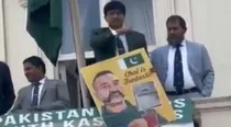 Pakistan officers throat slit gesture