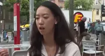 hardvard chinese student  compassion and unity message while two men fight behind video viral