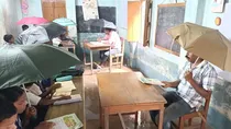 panchpara primary school students holding umbrella in class