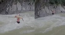 uttarakhand man crosses flooded river with ration on shoulder village demands bridge in chamoli