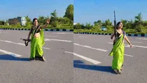 UP Woman Makes Gun Reel on Highway