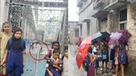 Murshidabad teacher not coming school on time children are getting drenched in the rain outside