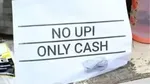 Bengaluru witnesses a shift back to cash transactions as small vendors remove QR codes due to GST concerns and tax notices.