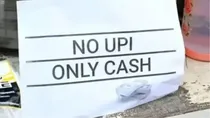 Bengaluru witnesses a shift back to cash transactions as small vendors remove QR codes due to GST concerns and tax notices.