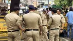 thief wears police uniform