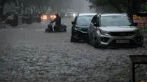 mumbai heavy rain red alert landslide waterlogging trains buses disrupted