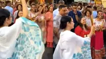 BJP TMC clash over Mamata Banerjee playing dandiya in durga puja amid kolkata flood