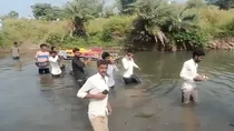 crossing the river for funeral carrying a dead body on shoulders 