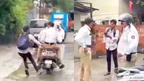 Fined bike rider confronts Mumbai cops halts their scooter Video goes viral